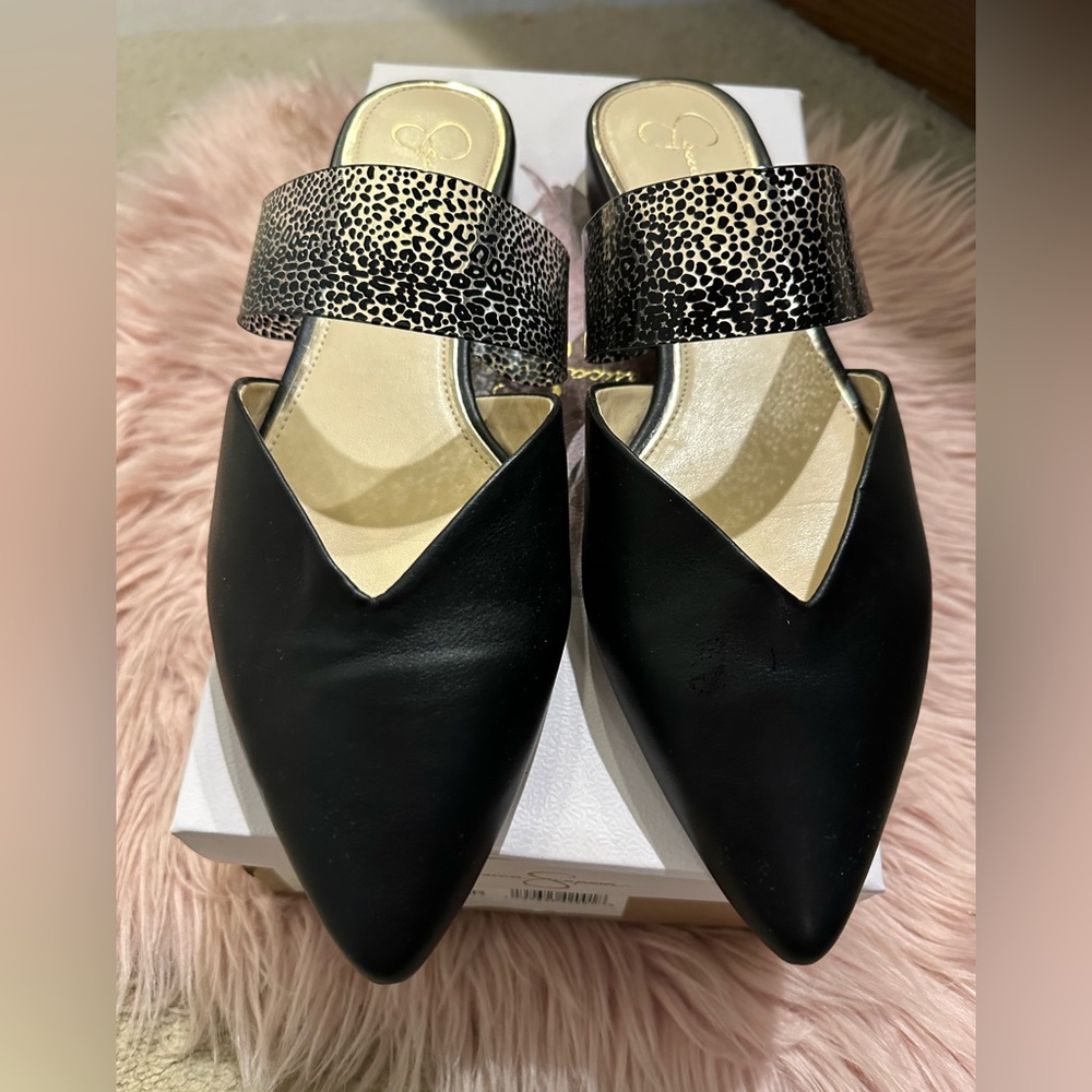 Sleek black leather mules